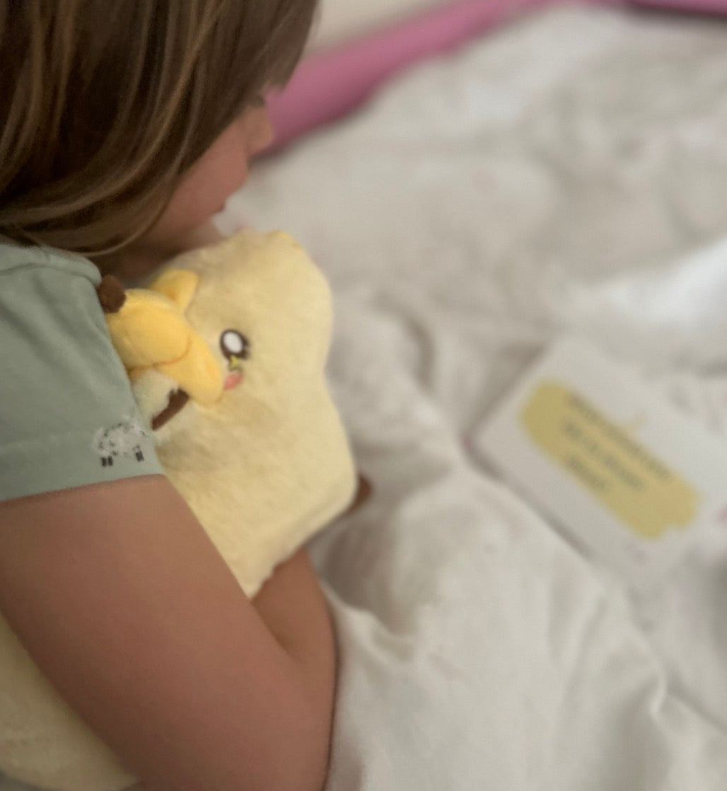 Child reading affirmation card at bedtime, Rest your worries, wild hearts