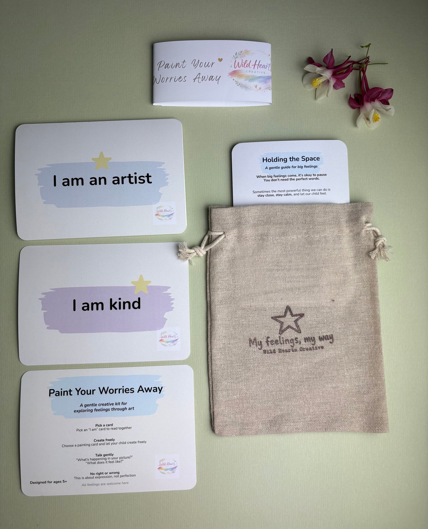 Wild Hearts Creative Paint Your Worries Away kit featuring creative reflection cards, affirmation cards, a Holding the Space guide and drawstring pouch. Designed to help children explore worries, anxiety and big feelings through painting, creativity and gentle conversation.