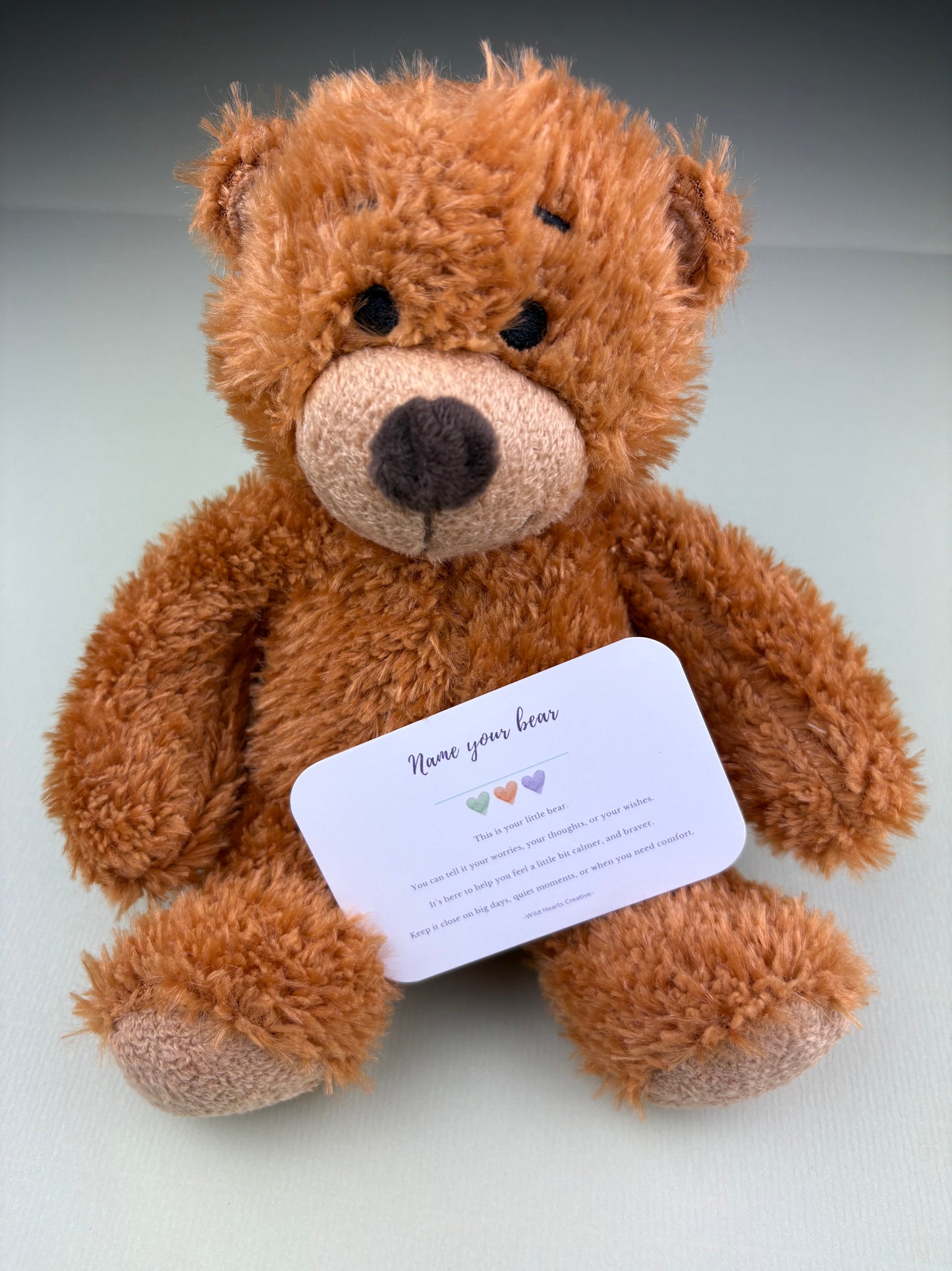 Soft teddy bear designed to provide comfort and emotional support for children during difficult moments.