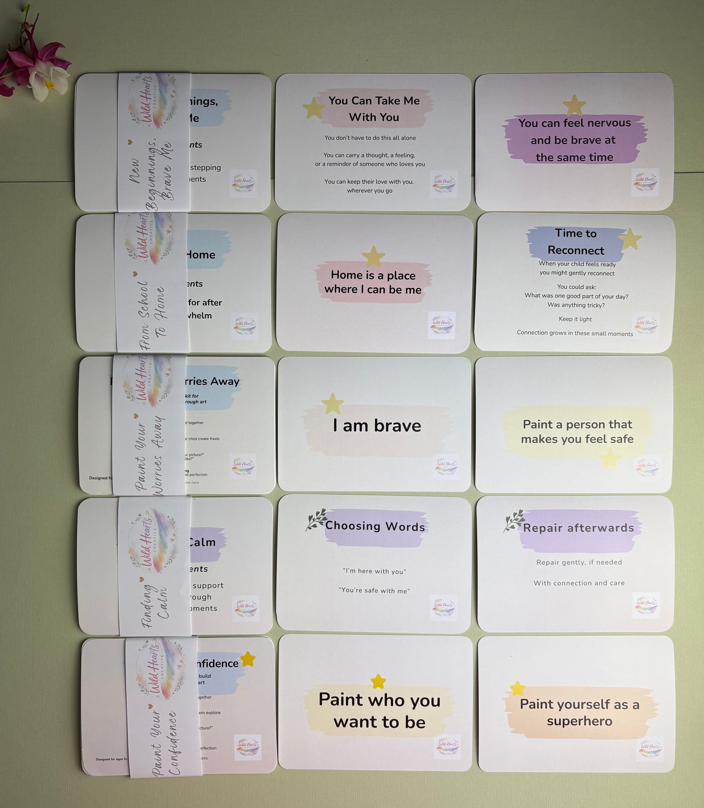 Collection of Wild Hearts Creative reflection cards displayed on a sage background, supporting emotional literacy, confidence, regulation and wellbeing.