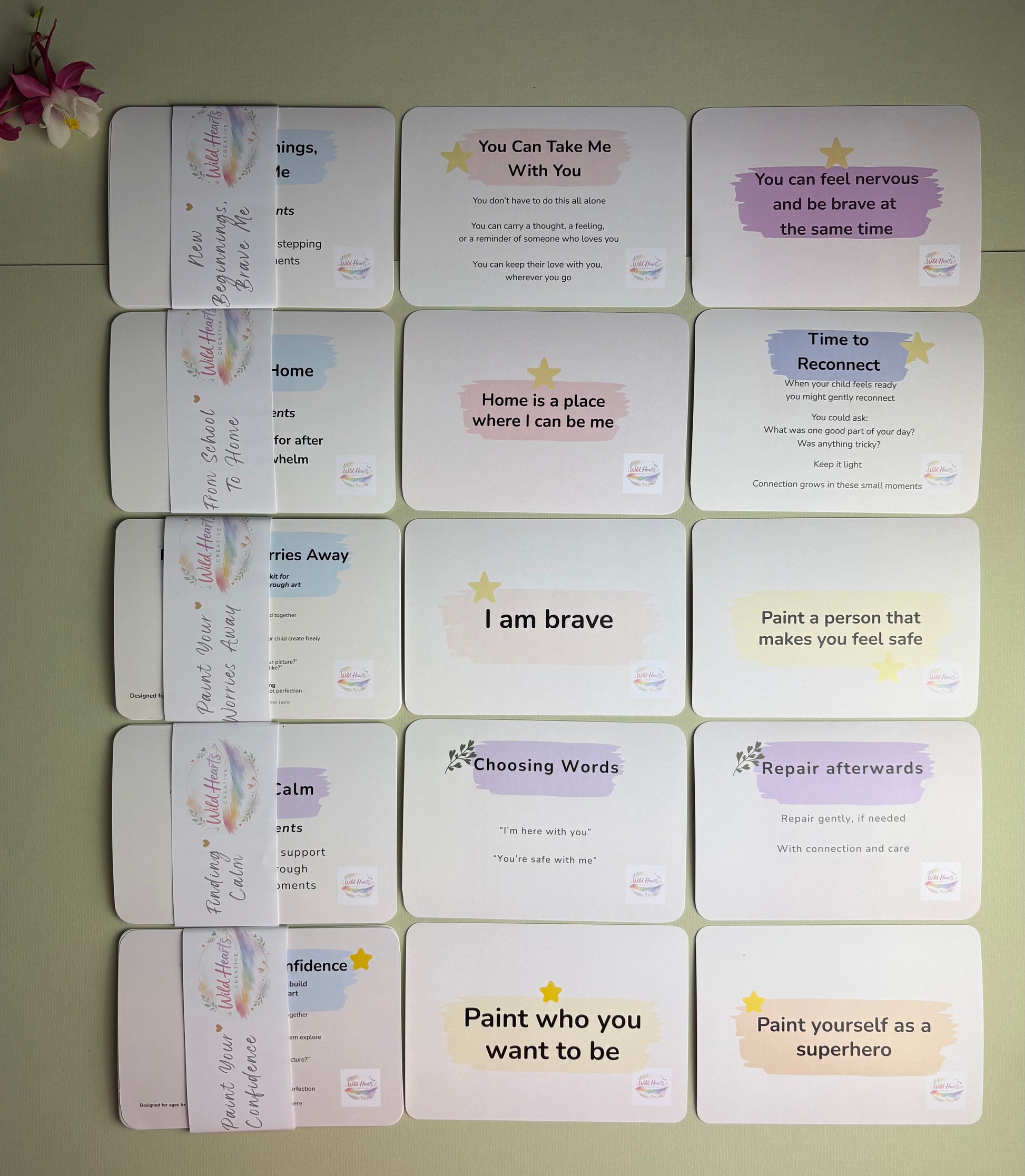Collection of Wild Hearts Creative reflection cards displayed on a sage background, supporting emotional literacy, confidence, regulation and wellbeing.