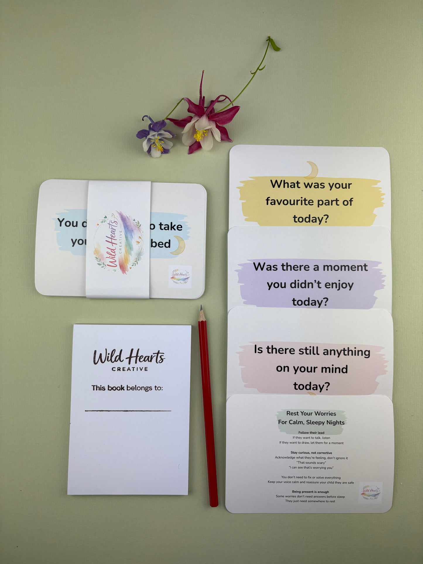 Flat lay of the Rest Your Worries Bedtime Mini Moments support kit for children, featuring calming prompt cards, reassurance cards, sketch pad and HB pencil Wild Hearts Creative packaging.