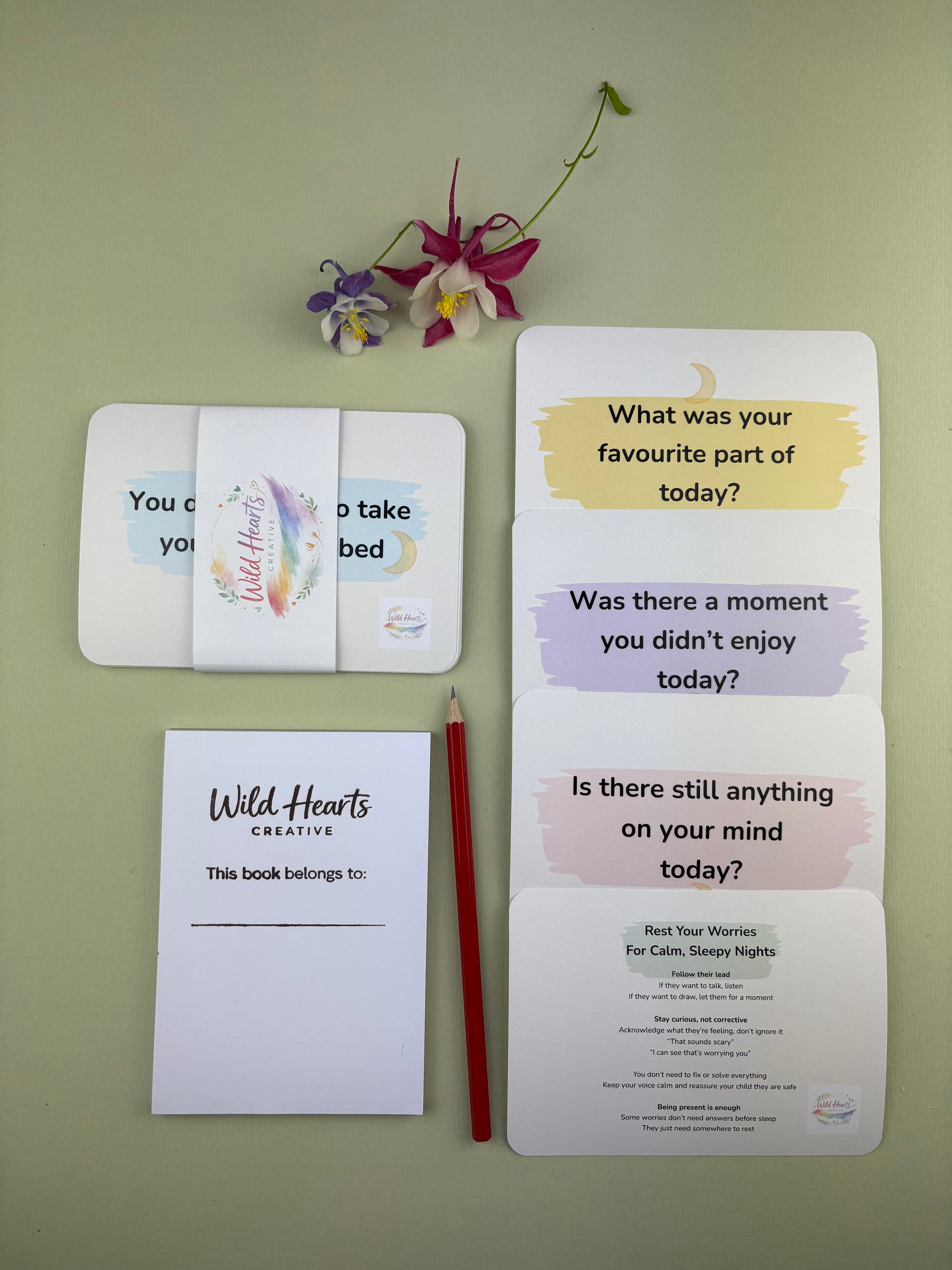 Flat lay of the Rest Your Worries Bedtime Mini Moments support kit for children, featuring calming prompt cards, reassurance cards, sketch pad and HB pencil Wild Hearts Creative packaging.