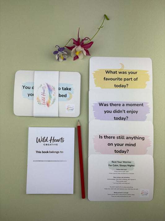 Flat lay of the Rest Your Worries Bedtime Mini Moments support kit for children, featuring calming prompt cards, reassurance cards, sketch pad and HB pencil Wild Hearts Creative packaging.