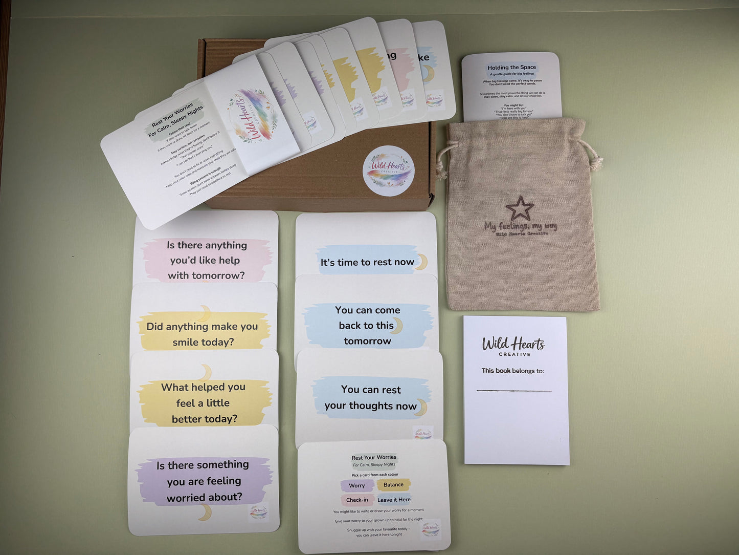 Flat lay of the Bedtime Rest Your Worries Mini Moments support kit for children, featuring calming prompt cards, reassurance cards, a drawstring pouch and Wild Hearts Creative packaging.