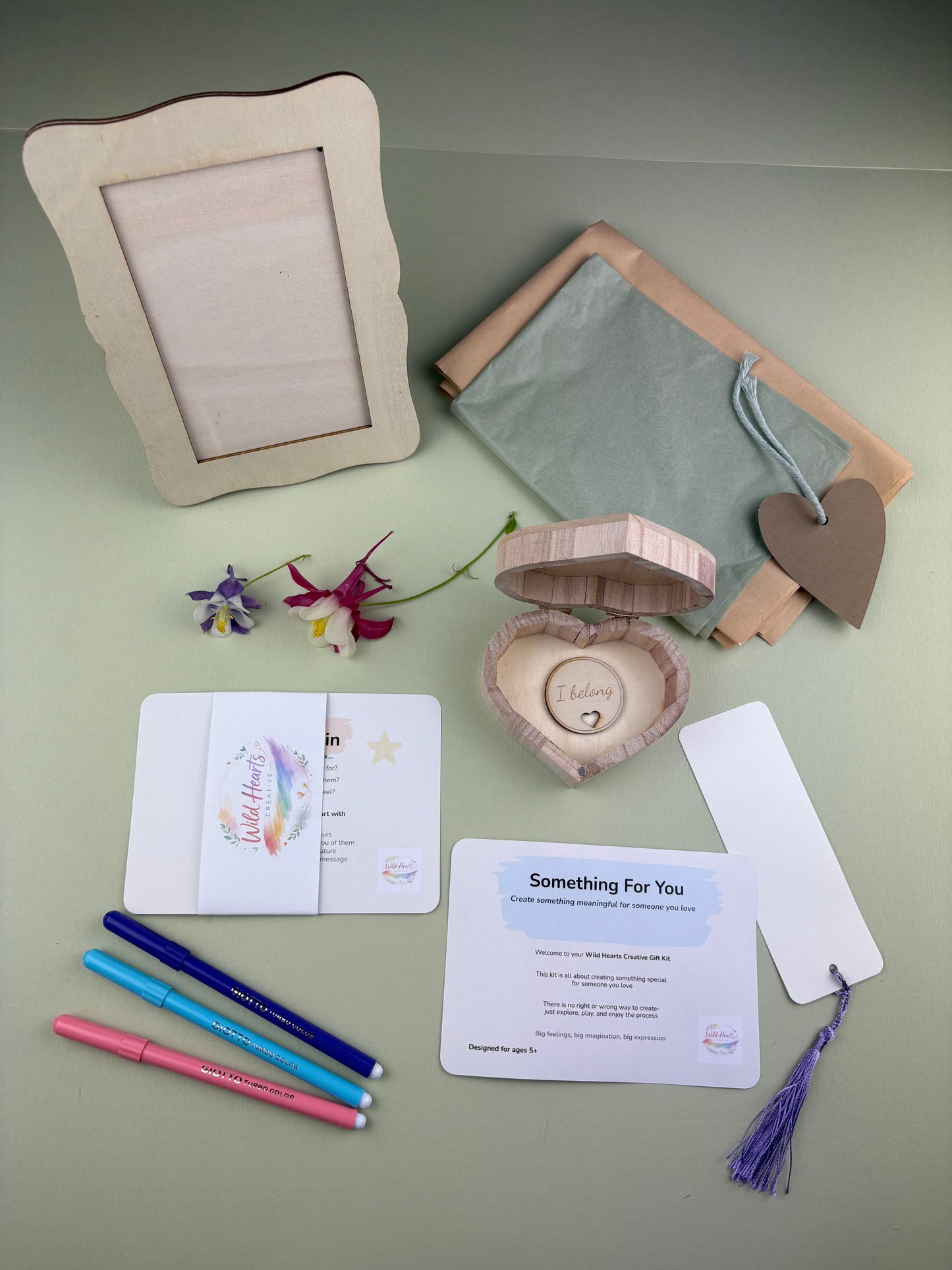 Creative keepsake kit for children with activity cards, pens, photo frame, wooden heart box, bookmark and craft materials for making meaningful gifts and memories.