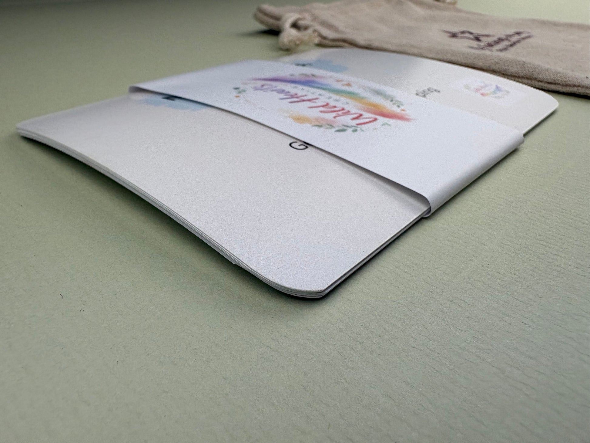 Close-up of a Wild Hearts Creative card collection secured with a branded belly band, showcasing high-quality rounded cards designed to support children’s emotional wellbeing through creative prompts and affirmations.