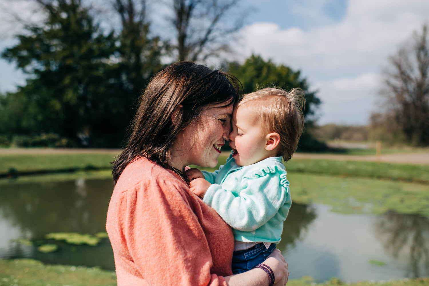 Mother holding adopted daughter and showing the bond created
