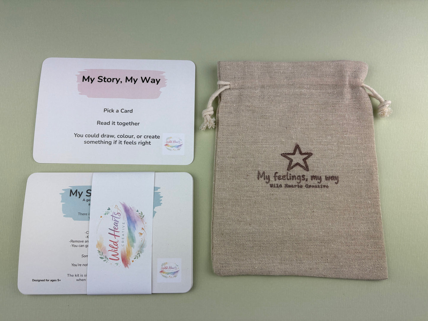 Wild Hearts Creative My Story My Way adoption support card collection with affirmation cards and drawstring pouch on a sage green background.