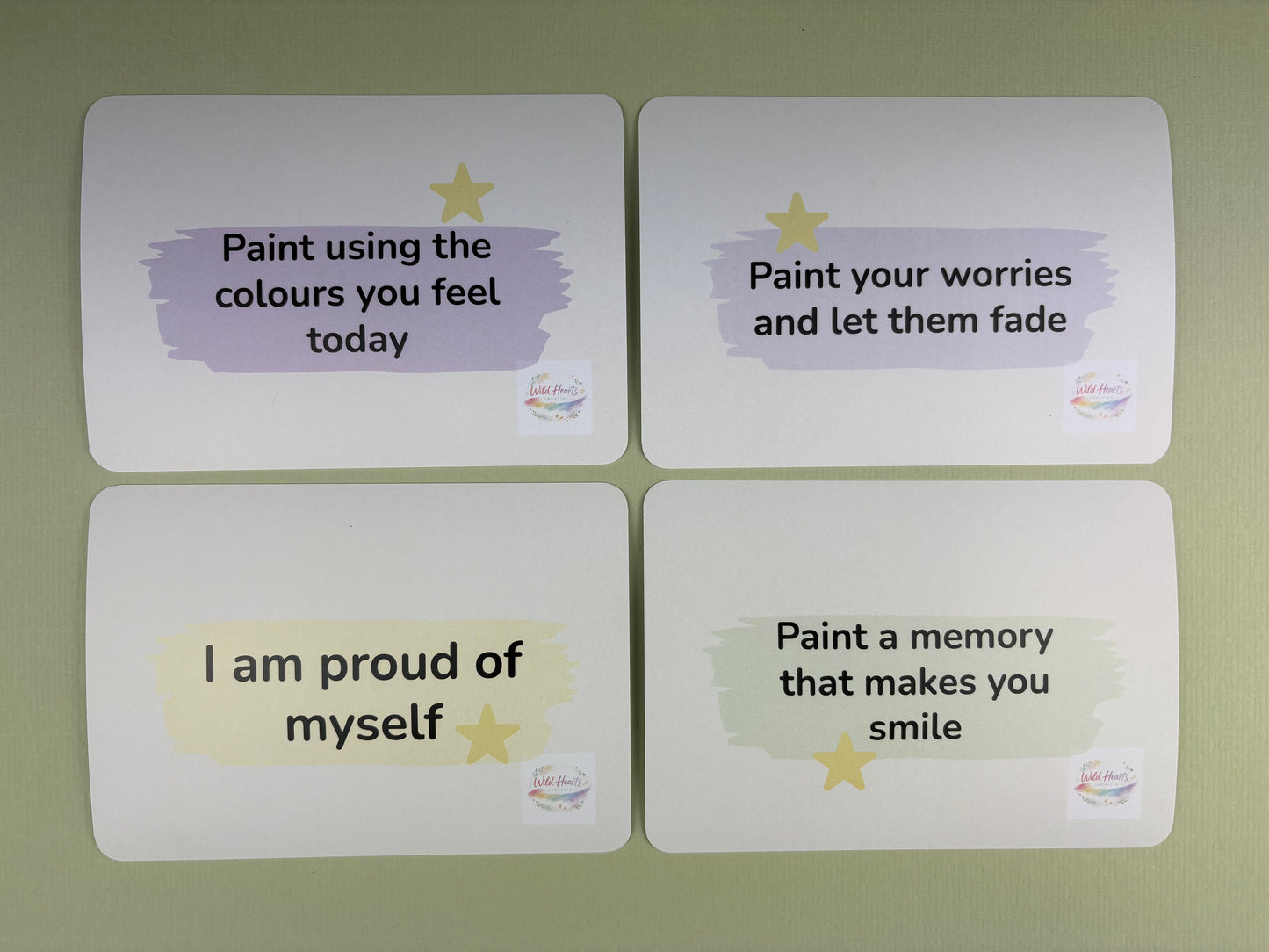 Four motivational cards with inspirational messages on a green background