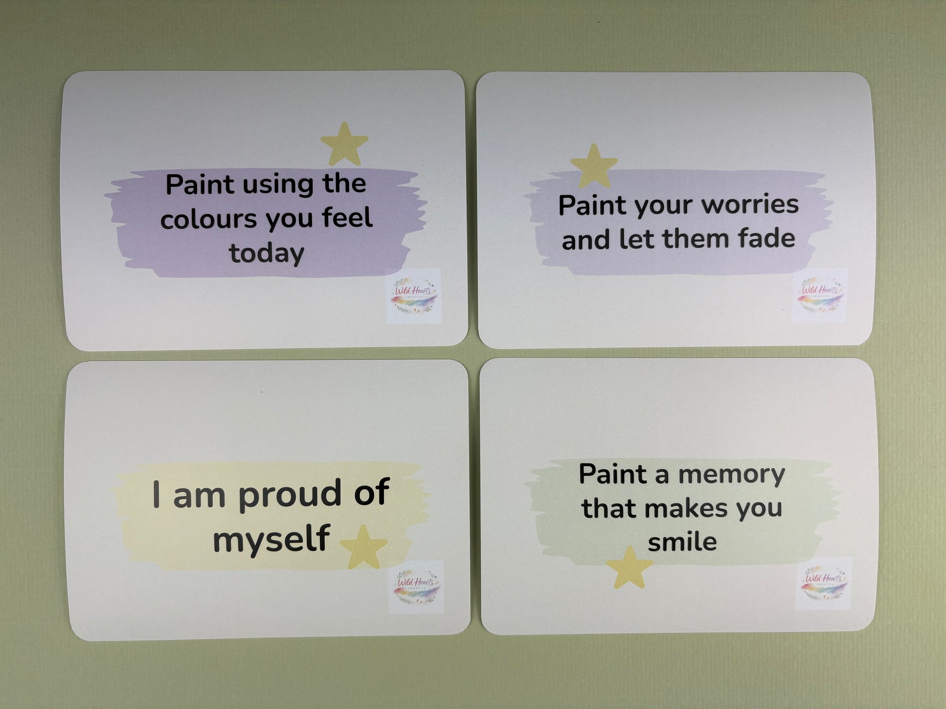 Four motivational cards with inspirational messages on a green background