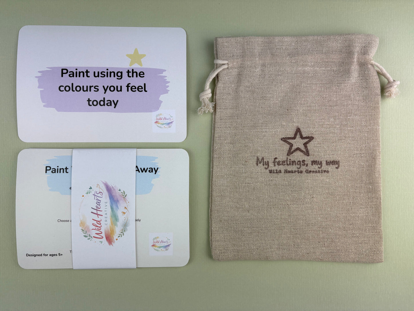 Wild Hearts Creative Paint Your Worries Away Anxiety support card collection with affirmation cards and drawstring pouch on a sage green background.