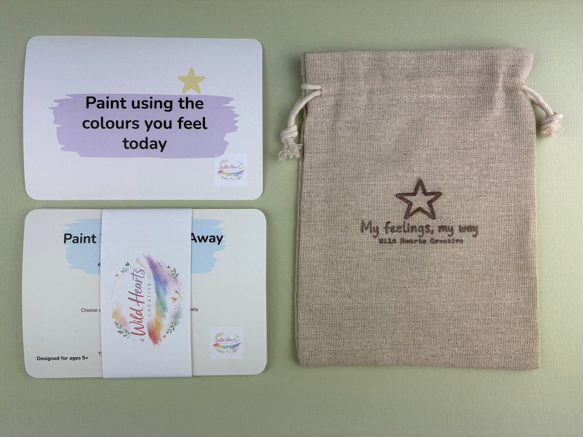 Wild Hearts Creative Paint Your Worries Away Anxiety support card collection with affirmation cards and drawstring pouch on a sage green background.